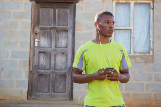 istock Getting my music playlist ready on my phone 908907018