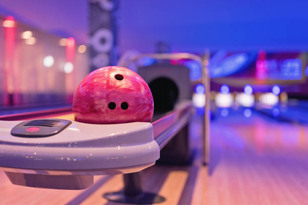 Teennager holding bowling ball. Young asian teenager holding bowling ball,bowling shoes and ball for bowling game,relaxing concept. bowling alley stock pictures, royalty-free photos & images