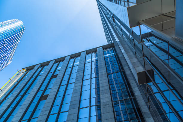 istock High modern skyscrapers over blue sky 908916210