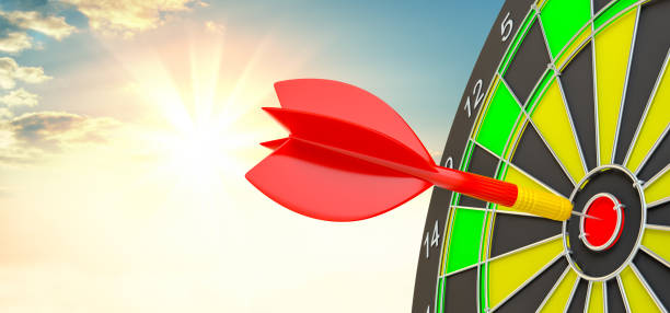 istock Red arrow is rushing to center of target dartboard 908917828