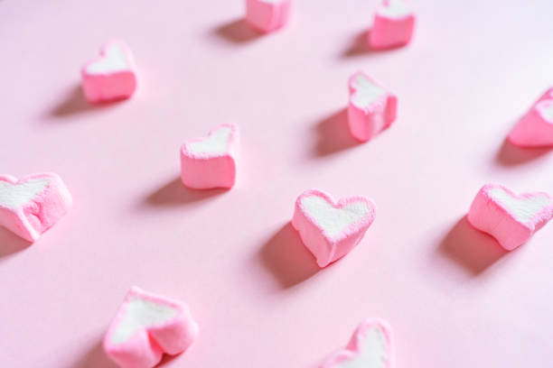 istock Pink Heart Shape Sweet Marshmallow, on Pink Pastel Coloured Background 908920154