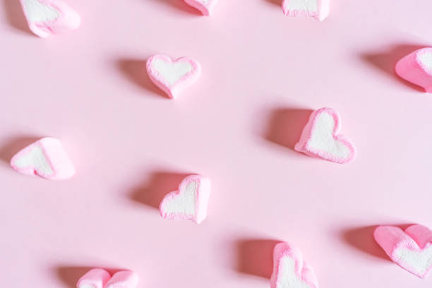 istock Pink Heart Shape Sweet Marshmallow, on Pink Pastel Coloured Background 908920206