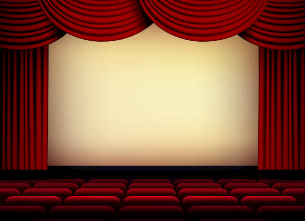 istock theater or cinema auditorium screen with red curtains and seats 908920468