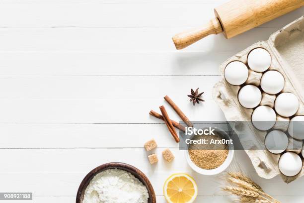 Baking Ingredients On White Table Home Baking Concept Stock Photo - Download Image Now