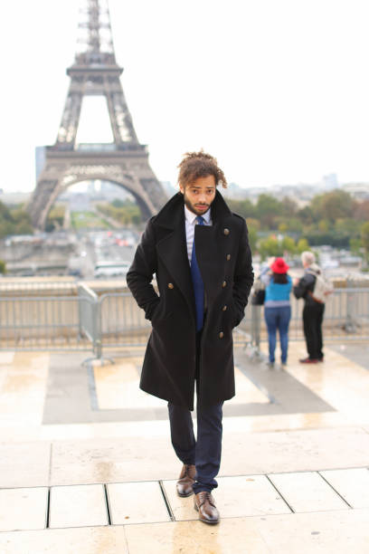 istock male model smiling near Eiffel Tower 908928864