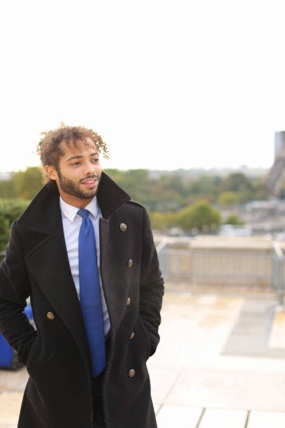 istock male model smiling near Eiffel Tower 908928874
