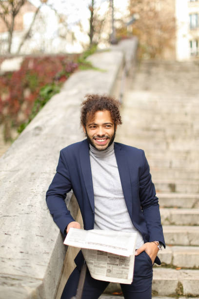 istock Upset guy reading newspaper outdoor 908931550