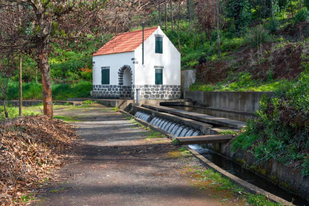 Hiking in Madeira Well with attached house feeding a Levada. Leavdas are irrigation channels specific to the island of Madeira. thomas wells stock pictures, royalty-free photos & images