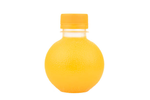istock Orange juice in a plastic bottle. Bottle Orange Shape. 908933290