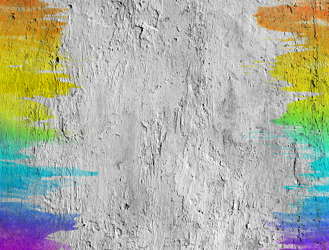 Concrete wall with colored brush strokes.