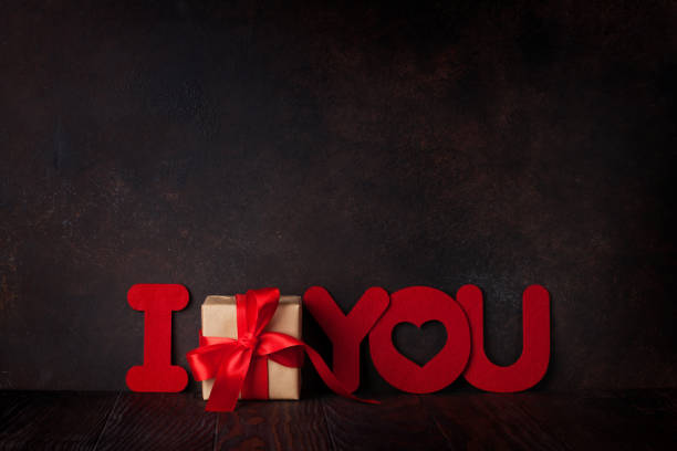 istock Valentines day greeting card with gift and words 908941268