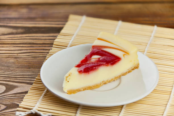 istock delicious cheesecake with strawberries on  plate 908944094