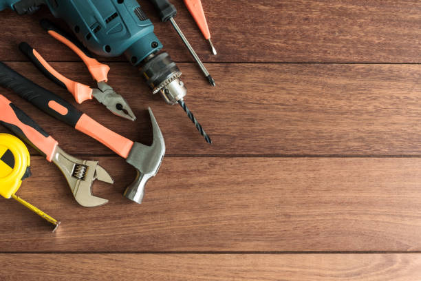 istock Set of work tools on wooden background 908951612