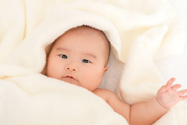 istock Baby wrapped in a towel 908951762