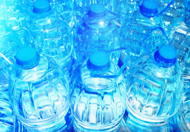 High angle view of a large group of plastic bottles of water. Can be used as background.