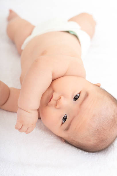 istock Baby on white towel 908952702