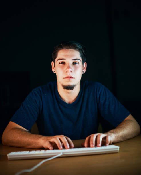 istock Young man typing on computer keyboard stares at the screen 908952778
