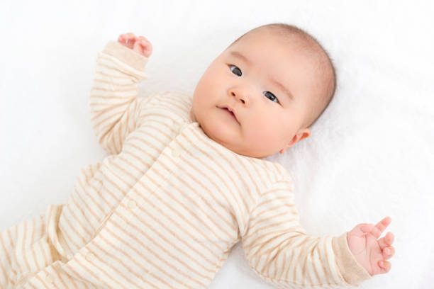 istock Baby on white towel 908952900