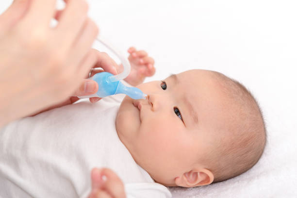 istock Suck off baby's runny nose 908953990