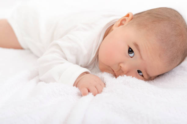 Rolling over baby on the bed