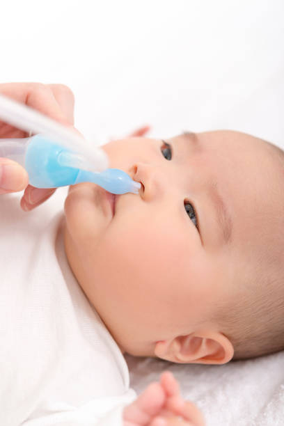 istock Suck off baby's runny nose 908956718