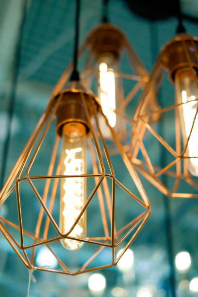 istock vintage lightbulb with golden or brass decoration 908963776