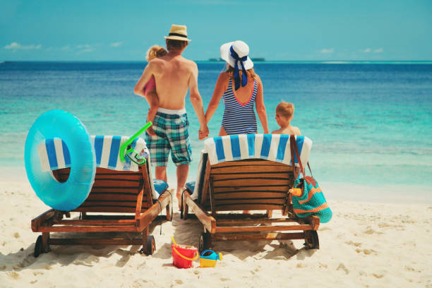 istock family with kids on beach vacation 908968302
