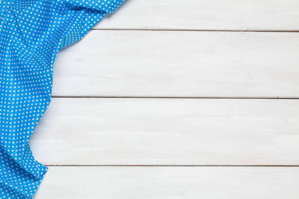 istock Color napkin wooden white background 908968438