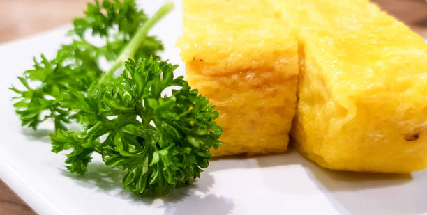 istock Omelette Japanese food with Parsley on White Plate. 908970404