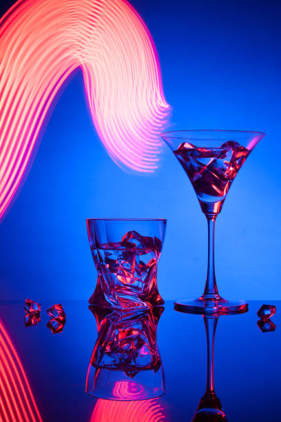 istock Two glasses a cocktail of beautiful light effects. 908970488