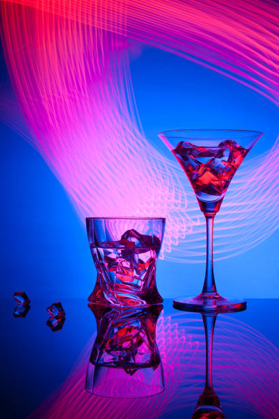 istock Two glasses a cocktail of beautiful light effects. 908970498