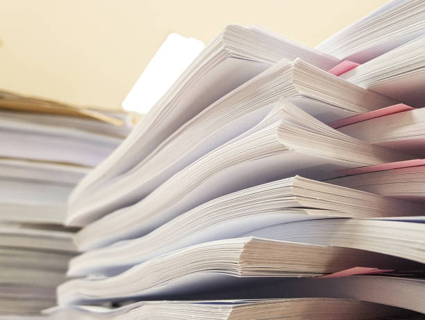 istock Stacks Paper document with pink paper,office concept background. 908971140