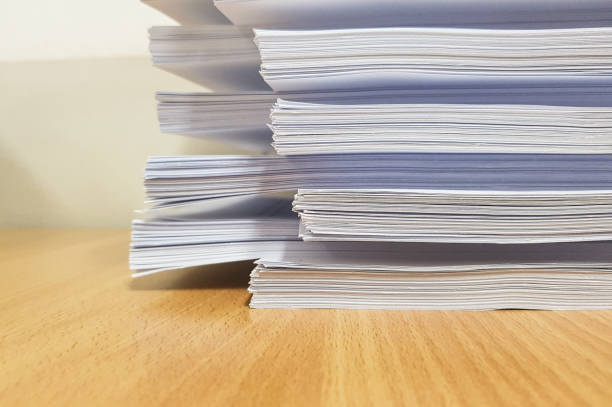 istock Stacks of white paper,Lined concept design,on desk. 908971280