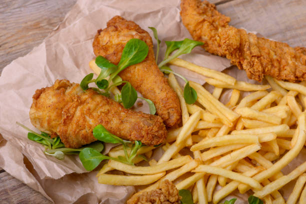 istock Closeup fried chicken meat and potato 908974756