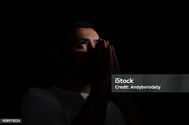 Man Praying To God In The Dark Room Stock Photo - Download Image Now - Adult, Adults Only, Bible