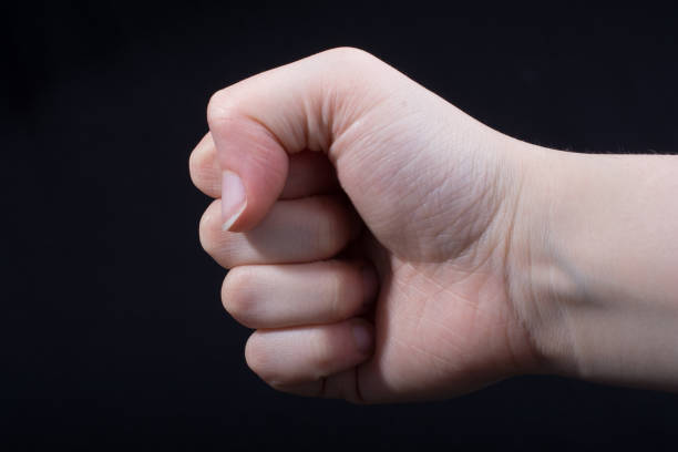 istock Hand closed for a fist gesture 908981142