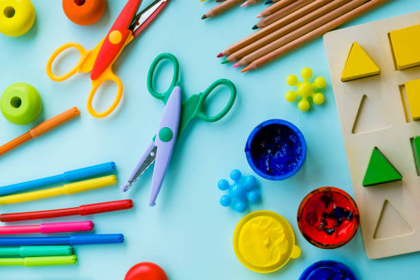 istock Top view on colorful paints and brushes. Creative ideas, creativity and early learning. Education concept 908982596