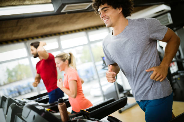 istock Young handsome man doing cardio training in gym 908982684