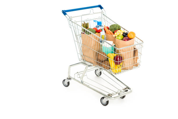 istock grocery bags in shopping trolley isolated on white 908985672