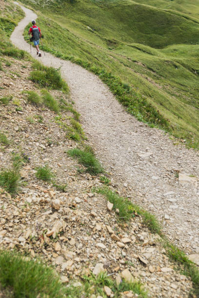 Senior man trail hiking on the Dolomites