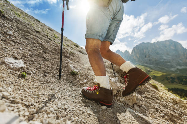 istock Senior man trail hiking on the Dolomites 908988826