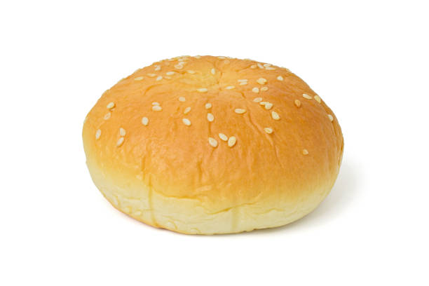 istock Burger bun with white sesame seeds isolated on a white with clipping path 908988920