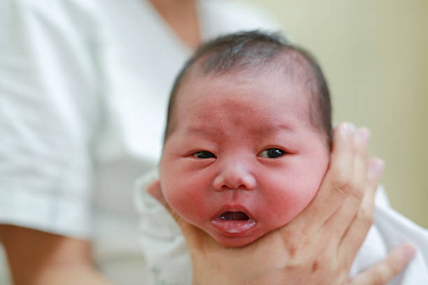 istock Mother is belching for infant baby. 908988940