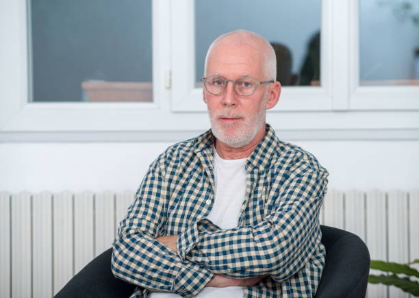 istock portrait of a middle-aged man with a beard and glasses 908999528