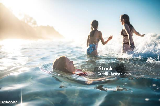 Friends Swimming In The Ocean In Summer Stock Photo - Download Image Now - Swimming, Beach, Sea