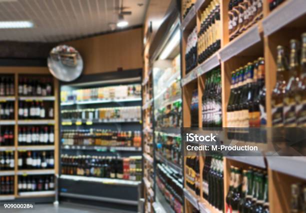 Blurred Image Of Shelves With Alcoholic Drinks In Supermarket Stock Photo - Download Image Now