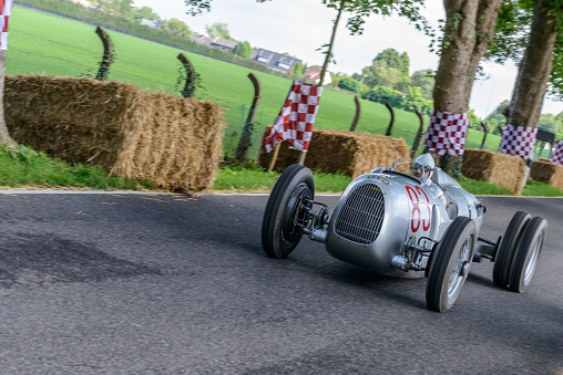 Auto Union Grand Prix Rennwagen Type C V16 driving at high speed. The Auto Union Grand Prix cars were racing for Nazi Germany in the 1930s. The car is doing a demonstration drive during the 2017 Classic Days event at Schloss Dyck.