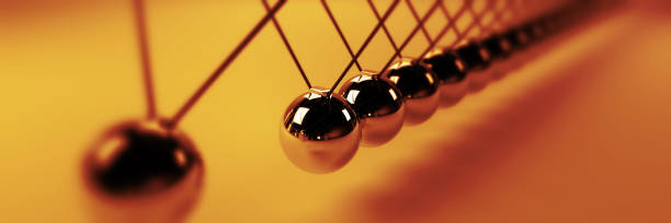 istock Newton cradle, cause and effect concept, golden infinity Newton's cradle (3d illustration banner) 909000908