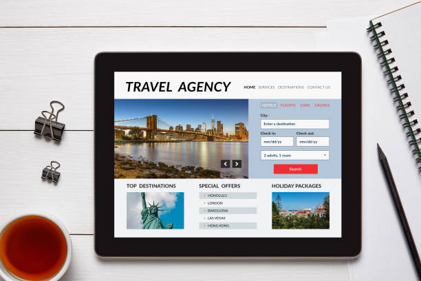 istock Travel agency concept on tablet screen with office objects 909001554