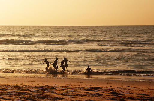 Kids playing at african coast of Gambia